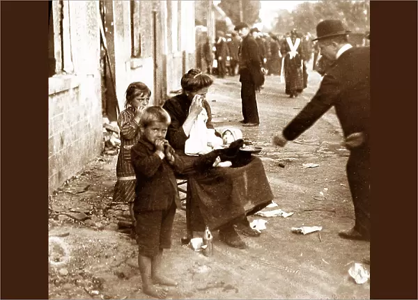 WW1 Belgian woman and children begging in front