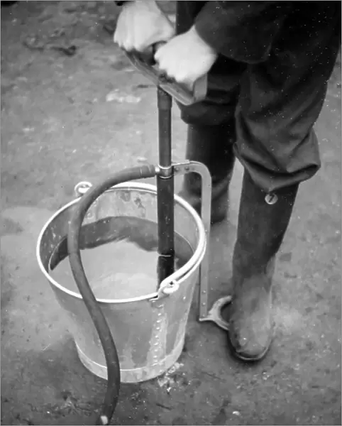 Using a stirrup pump, ARP training exercise during WW2