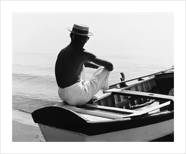 Man Sitting in a Boat