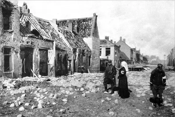 Photographed during the fierce German bombardment of the town: A ruined street in Nieuport