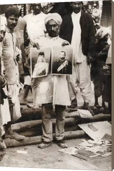 Indian street vendor with pictures of George V and Mary