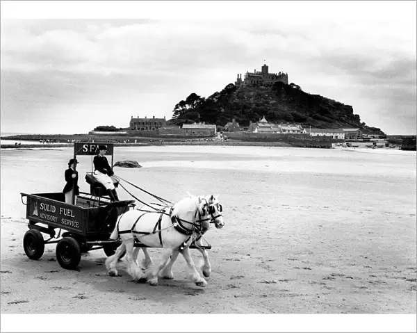 Shire horses and cart on Marazion beach, Cornwall