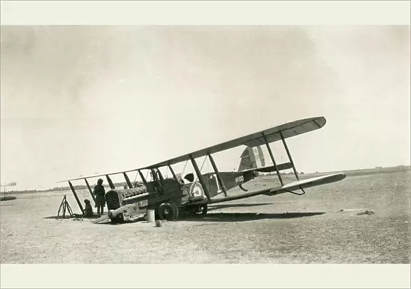 Crashed biplane with crew resting in the desert, Iraq