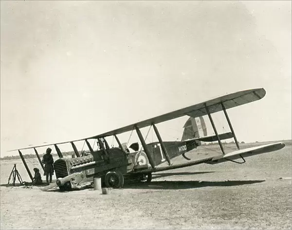 Crashed biplane with crew resting in the desert, Iraq