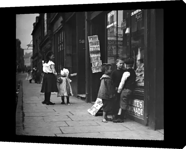 Edwardian children outside a shop