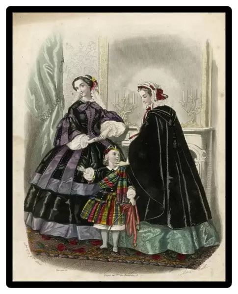 Two women and a child in the latest French fashions