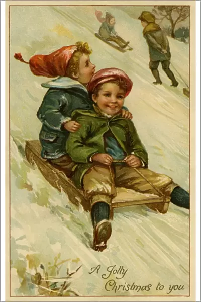 Christmas. 2 boys on a sledge