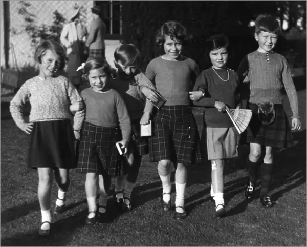 Queen Elizabeth II attends a birthday party as a girl