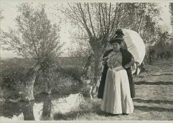 Plump woman with parasol by a stream