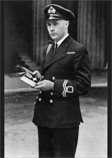 Lieutenant Ernest Gidden receiving the George Cross, 1942