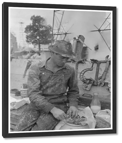 Oil field worker eating lunch, Kilgore, Texas