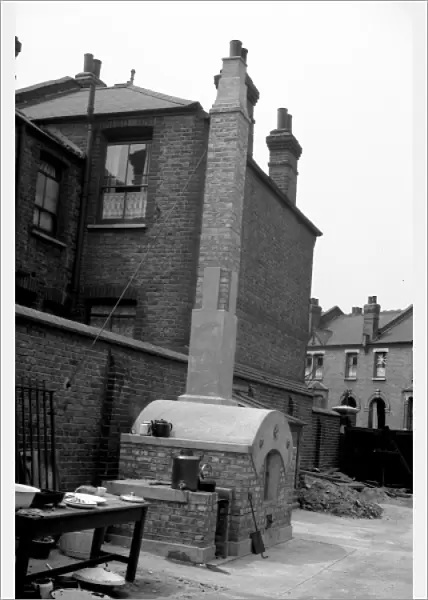 NFS sub-station with baking oven in yard, WW2