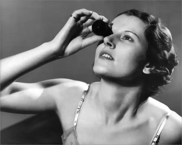 Woman Using Eye Bath