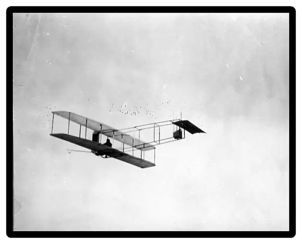 The 1911 Wright glider in flight with Orville Wright flying