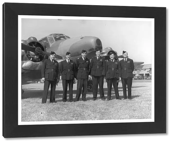 Air Transport Auxiliary pilots in front of an Avro Anson
