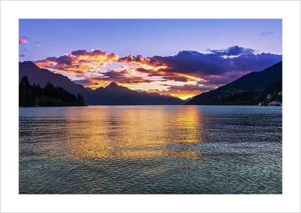 Sunset over Lake Wakatipu from Queenstown, Otago, South Island, New Zealand Date: 01-07-2021