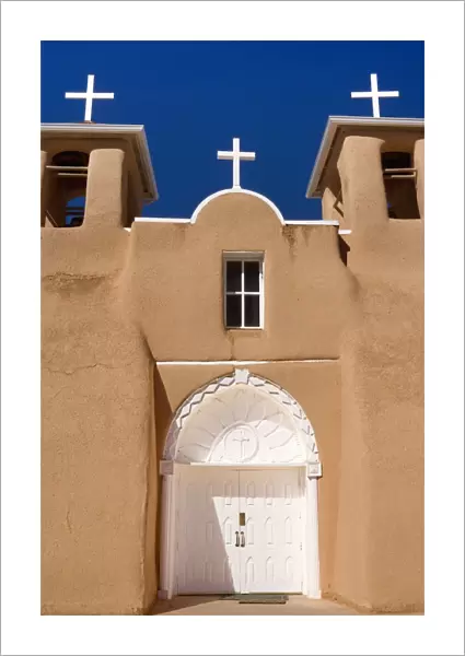 Mission San Francisco de Asis - front with entrance portal of this beautiful mission in adobe building style - Rancho de Taos, New Mexico, USA