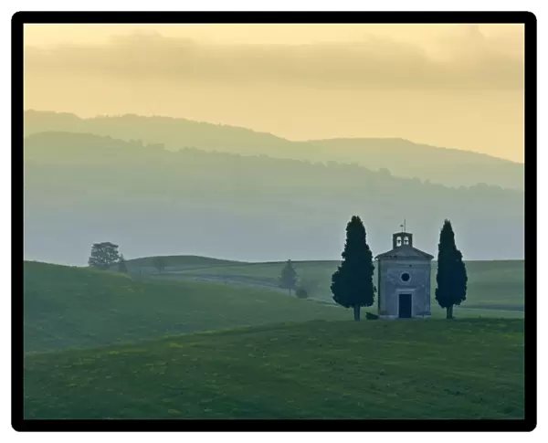 Chapel small chapel and cypress trees on a hill Val d Orcia, Tuscany, Italy