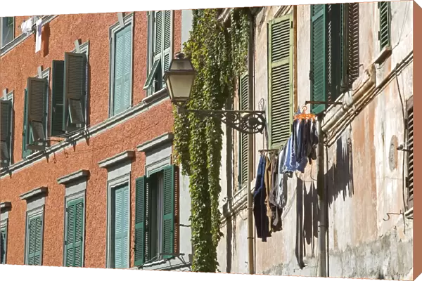 Trastevere - Rome - Italy - street scene with window shutters and laundry