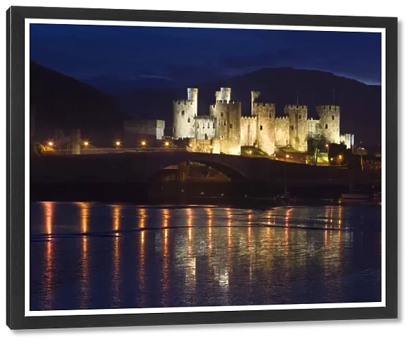 Conway Castle - at dusk with reflections in estuary - North Wales - UK