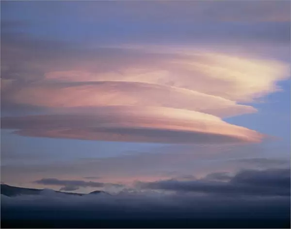 Stack of lenticular clouds over Mauna Kea, Hawaii