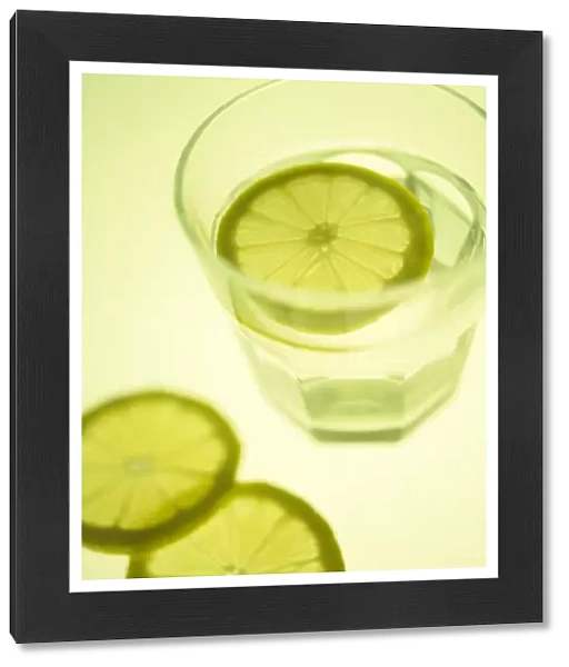 Glass of water with sliced lemon