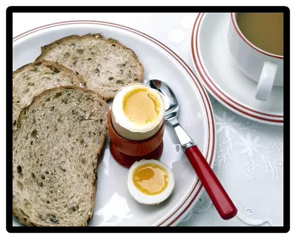 View of a healthy breakfast of egg, bread and tea