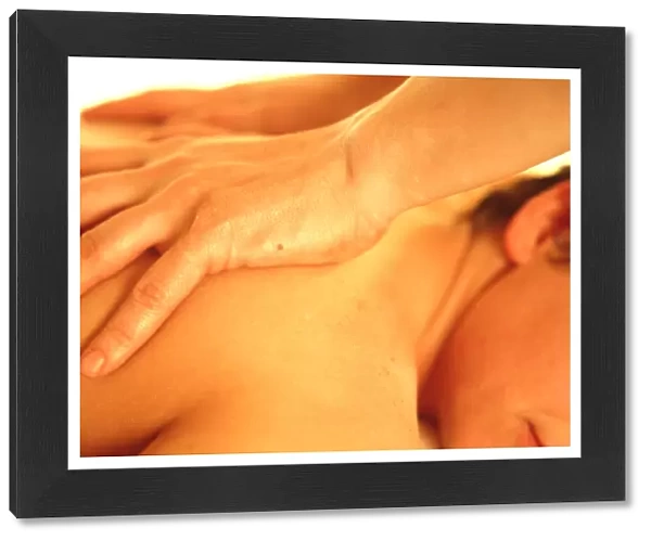 Massage. Mans hands massaging a womans back