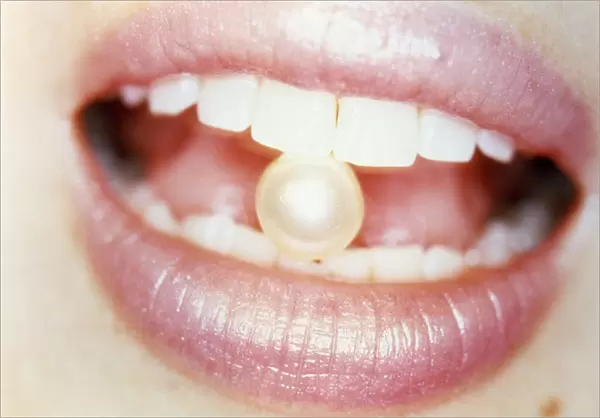 Pearl between teeth