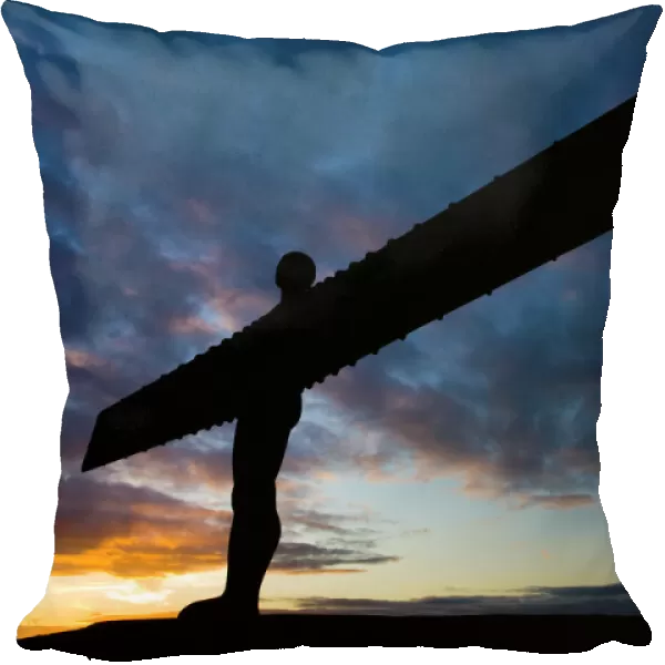 The iconic Angel of the North statue silhouetted against an atmospheric sky