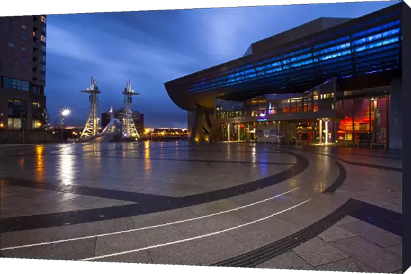 England, Greater Manchester, Salford Quays. The Lowry Centre at dusk looking towards the Lowry Bridge, located on the Salford Quays in the city of Salford near Manchester