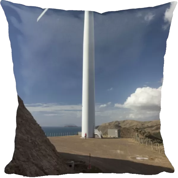 One of the turbines with a person for scale, West Wind wind farm of Meridian Energy at Makara, Wellington, North Island, New Zealand, Pacific