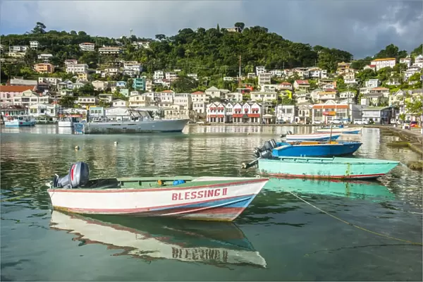 Little motoboat in the inner harbour of St. Georges, capital of Grenada, Windward Islands, West Indies, Caribbean, Central America