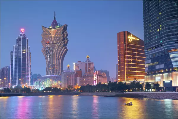 Grand Lisboa and Wynn Hotel and Casino at dusk, Macau, China, Asia