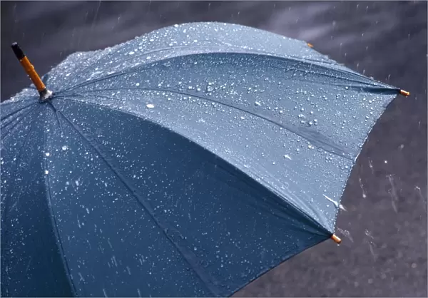 Rain falling on an umbrella