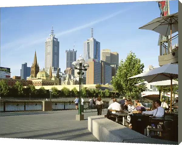 Open air cafe, and city skyline, South Bank Promenade, Melbourne, Victoria