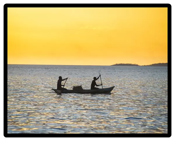 Backlight of fishermen in a little fishing boat at sunset, Lake Malawi, Cape Maclear
