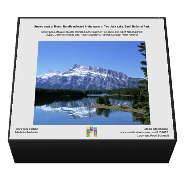 Snowy peak of Mount Rundle reflected in the water of Two Jack Lake, Banff National Park