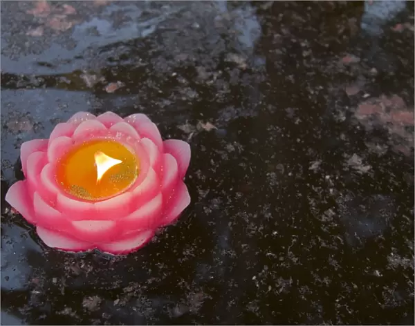Candle floating in Dafo temple, Leshan, Sichuan, China, Asia