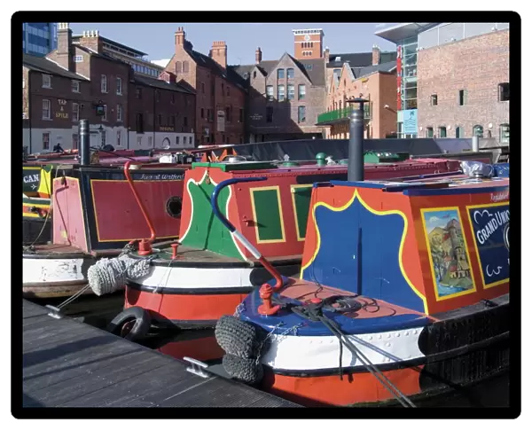 Narrow boats and barges moored at Gas Street Canal Basin, city centre, Birmingham
