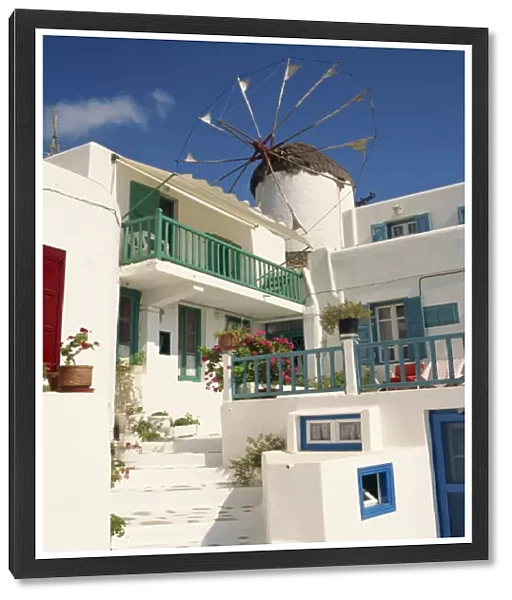 White house with windmill in the background on Mykonos