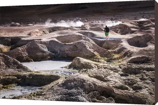 Tourist at Sol de Manana Geothermal Basin area, Altiplano of Bolivia, South America