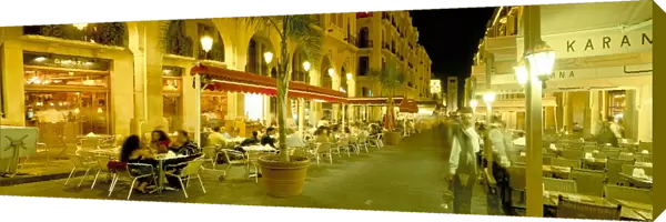Outdoor restaurants at night in downtown area of Central District