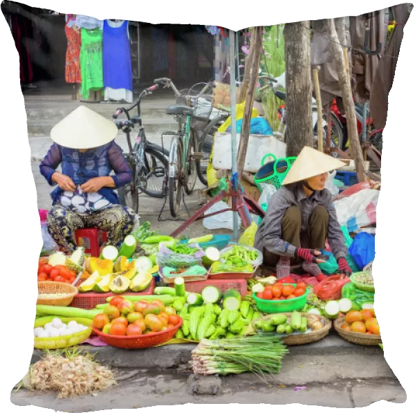 Women selling vegetables at the central market in Hoi An, Quang Nam Province, Vietnam