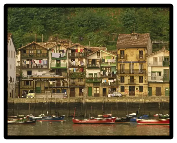 Traditional houses along the waterfront and small boats