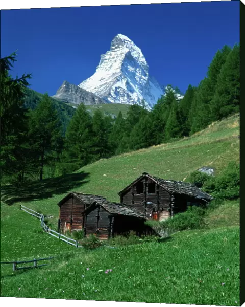 The Matterhorn towering above green pastures