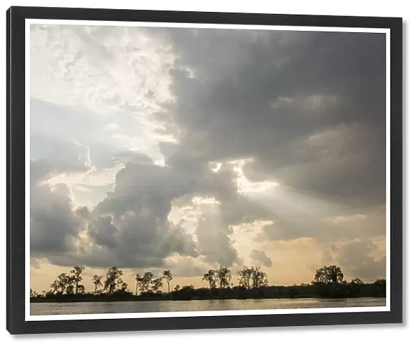 Sunburst through clouds on the Pacaya River, Upper Amazon River Basin, Loreto, Peru