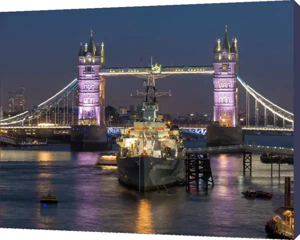 Tower Bridge and HMS Belfast on the River Thames at dusk, London, England, United Kingdom