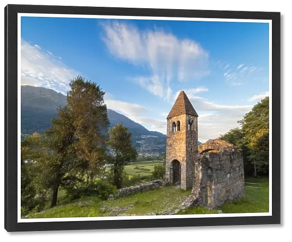 Sunset sky frames the ancient Abbey of San Pietro in Vallate, Piagno, Sondrio province