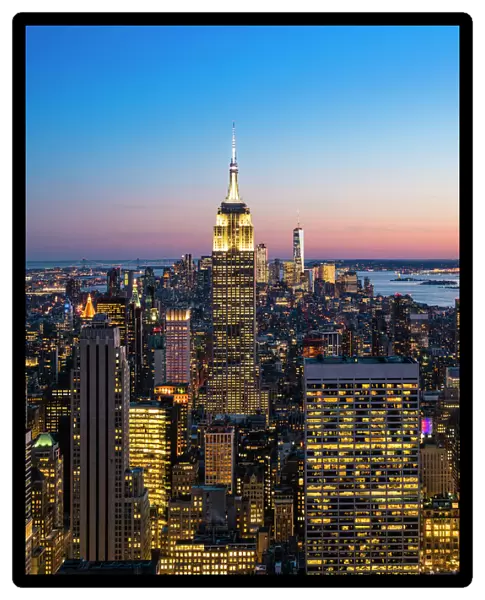Manhattan skyline and Empire State Building at dusk, New York City, United States of America